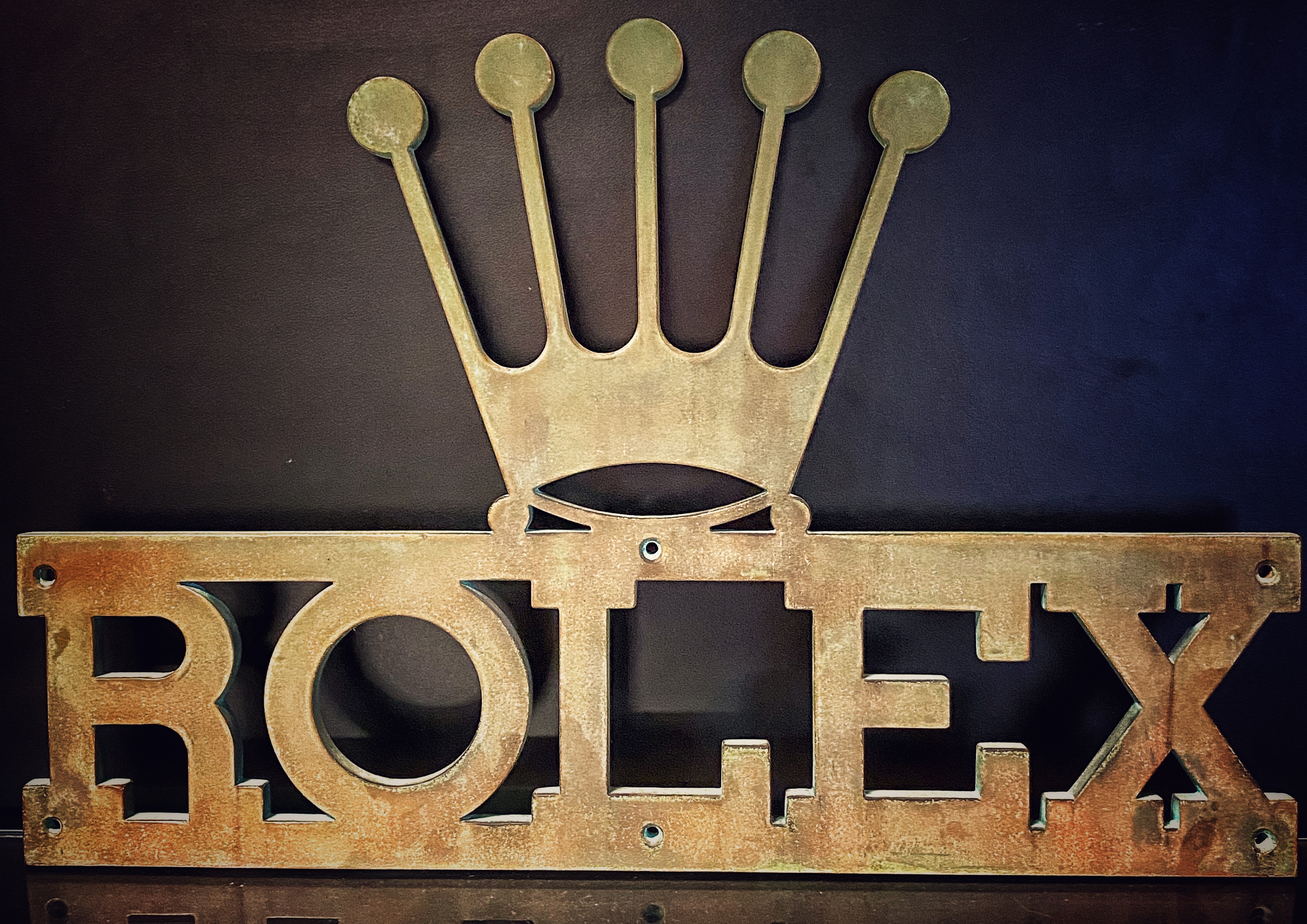 Golden Rolex sign