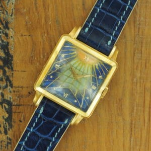 Full front view of 18K Gübelin Square Cloisonne Dial