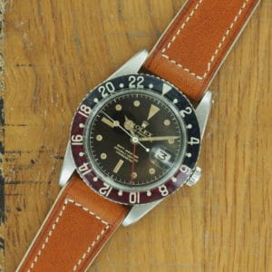 Full front view of S/Steel Rolex GMT-Master tropical dial 6542 from 1958