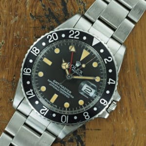 Front face of S/Steel Rolex GMT-Master black insert 1675 from 1978