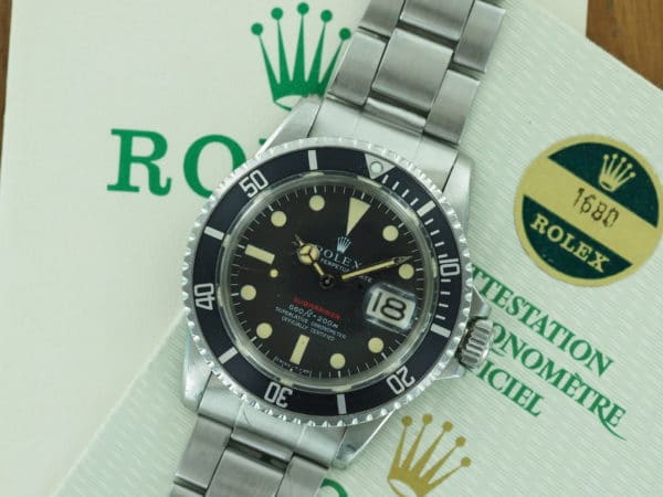 Front face of S/Steel Rolex "red" Submariner from 1972 with papers