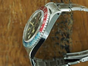 Left side of S/Steel Rolex GMT-Master pcg chapter ring gilt dial from 1962
