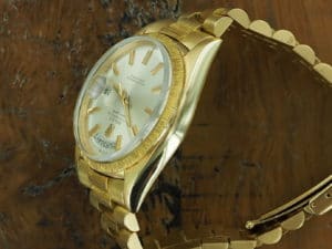 Left side of 18K Rolex Day-Date bark finish 1807 from 1967