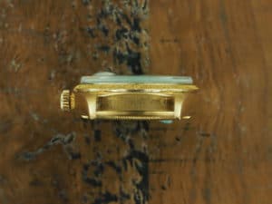 Top side of 18K Rolex Day-Date bark finish 1807 from 1967