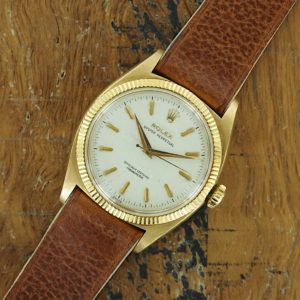 Front face of 18K Rolex Oyster Perpetual Honeycomb dial ref 6502 from 1955