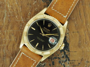 Front face of 18K Rolex Datejust Turn-O-Graph ref 6609 with black gilt dial from 1957