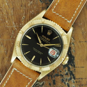 Front face of 18K Rolex Datejust Turn-O-Graph ref 6609 with black gilt dial from 1957