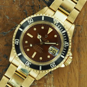 Front face of 1986 18K Rolex Submariner tropical dial 1680