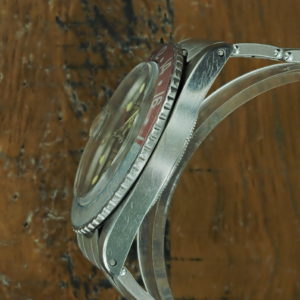 Left side of 1965 S/Steel Rolex GMT Master gilt dial Ref 1675