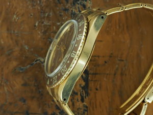 Full left side of 1966 18K Rolex GMT-Master ref 1675 "Concorde"